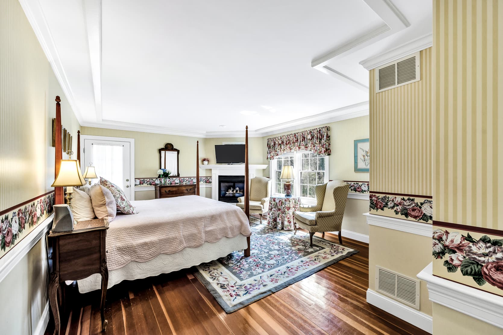 balcony with table and 2 chairs, garden view