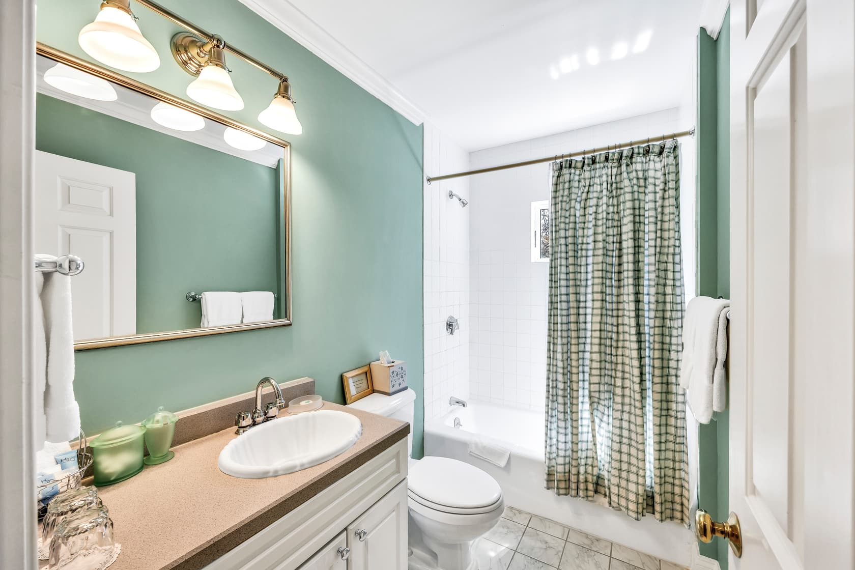 private patio area with red brick with table and chairs