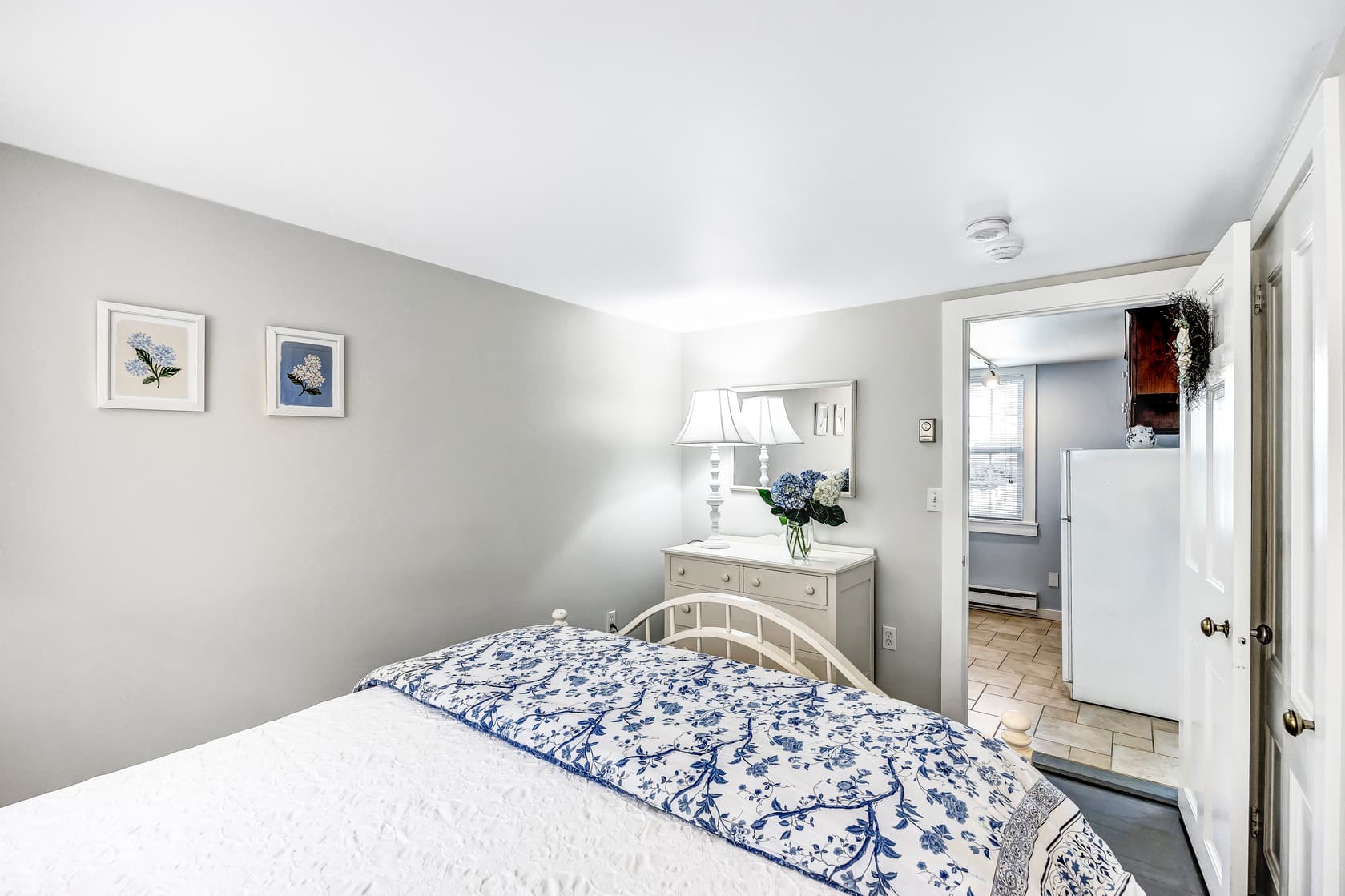 view of fireplace, wooden mantle and flatscreen TV, from the loft space above