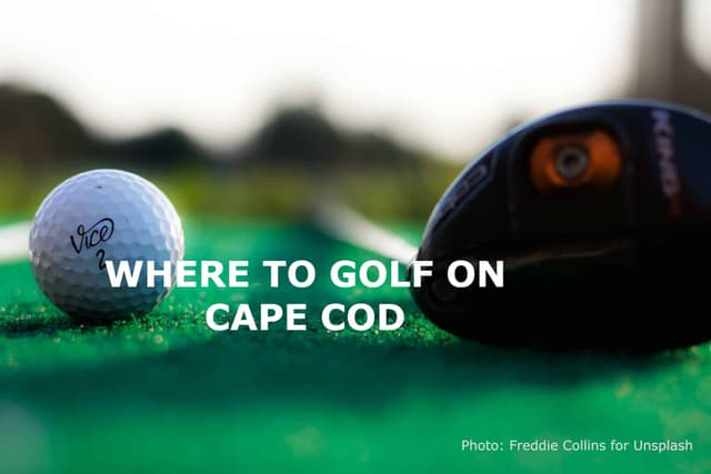 A very close up look at the head of a driver next to a white golf ball.