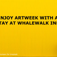 YELLOW BACKGROUND WITH WOMAN WALKING THROUGH IT AND TITLE: ENJOY ARTWEEK WITH A STAY AT WHALEWALK INN